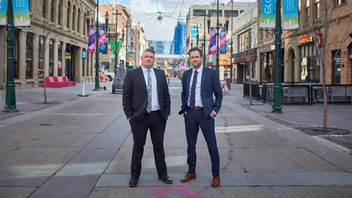Two business professionals standing together in downtown Calgary
