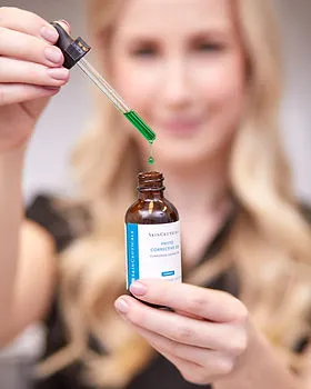 Branding photograph of a woman working with a skincare product
