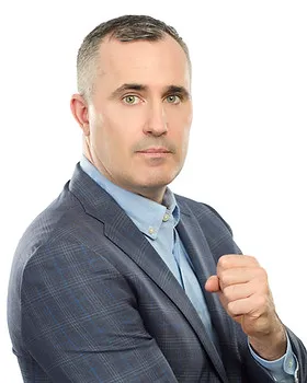 Professional headshot of a man in a suit